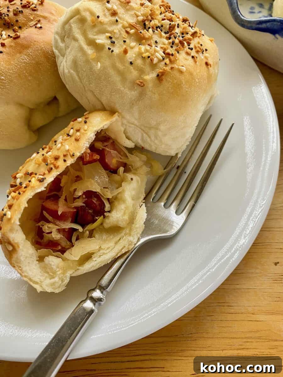 Little Smokie and sauerkraut filling in a halved portion of a dinner roll