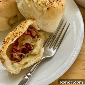 Little Smokie and sauerkraut filling in a halved portion of a dinner roll