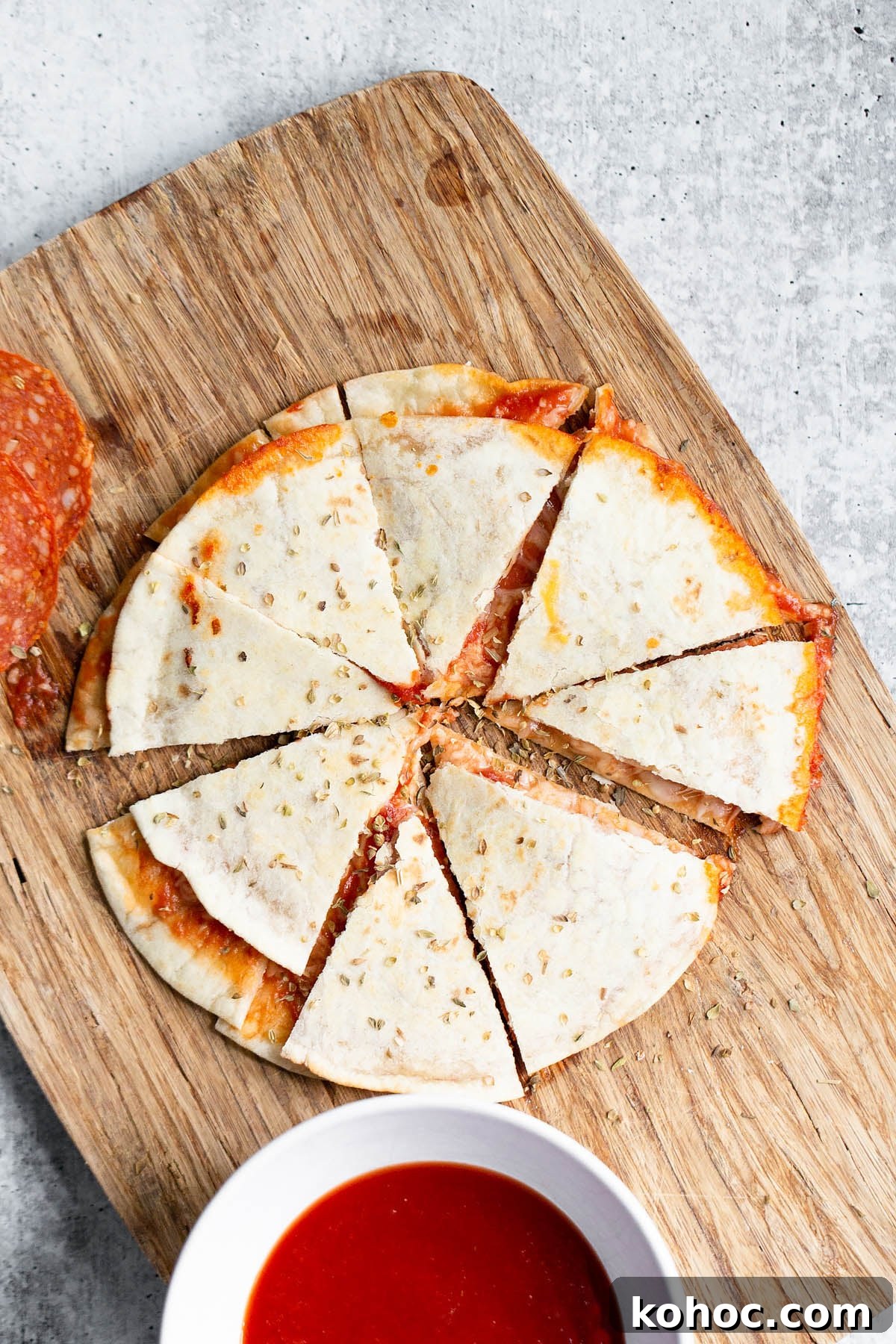 pizza quesadilla on a cutting board