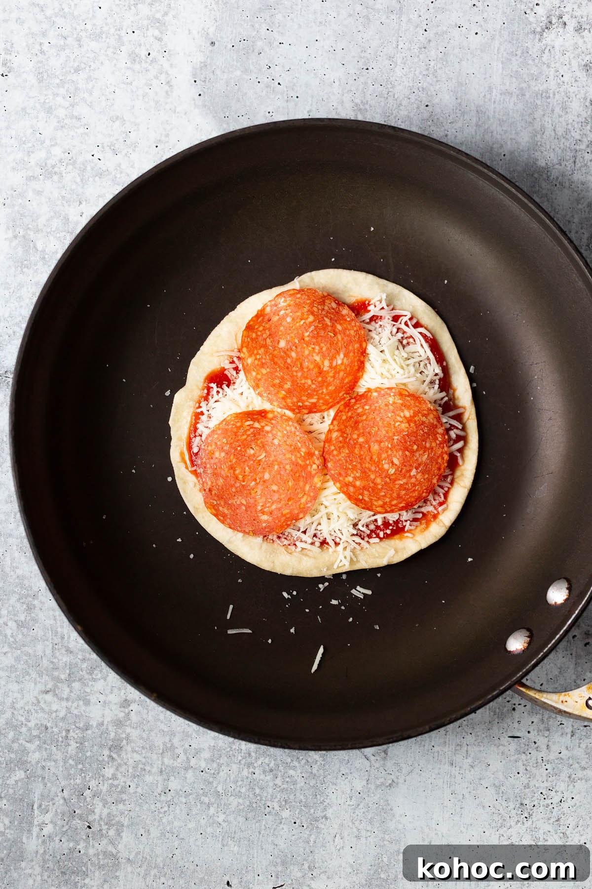 making a pizza quesadilla with pepperoni