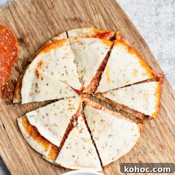 pizza quesadilla on a cutting board