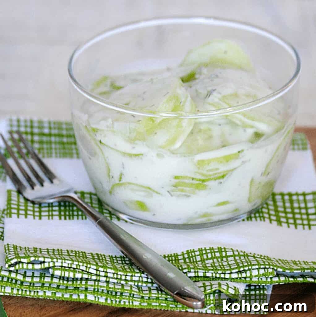 Creamy Cucumber Salad with Sour Cream Dressing 2 creamy cucumber salad with sour cream in a glass bowl