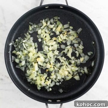 Sautéed onion and garlic in a skillet.