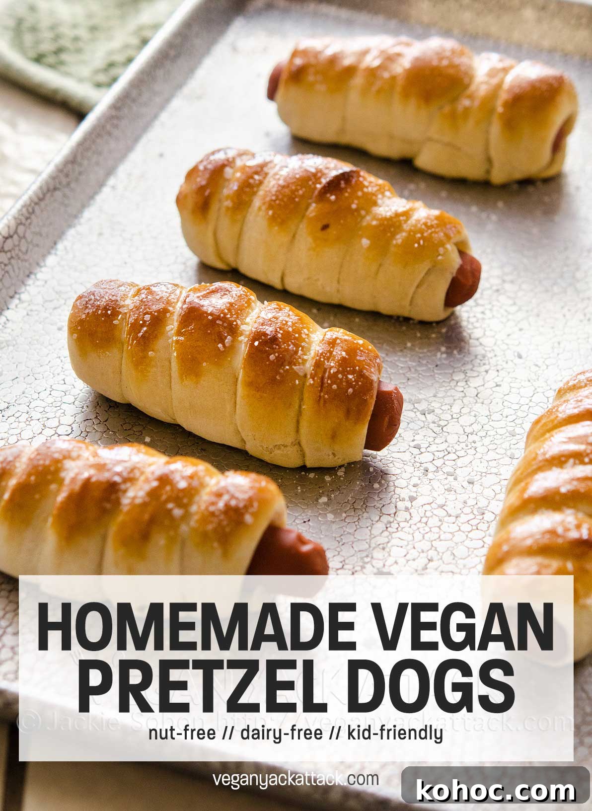 A fun recipe for vegan pretzel dogs, plus you can enter for a chance to win your own copy of Bake & destroy, by Natalie Slater! sheet pan of hot dogs wrapped in pastry with text overlay 'homemade vegan pretzel dogs'