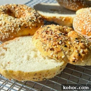 30 High-Protein Dinner Recipes for Muscle & Weight Goals 9 Several bagels on a cooling rack, some topped with mixed seeds.