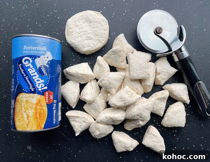 Bubble-Up Biscuit Pizza Casserole Recipe for Family Nights 5 Refrigerated biscuit dough cut into quarters to make an easy pepperoni pizza casserole.
