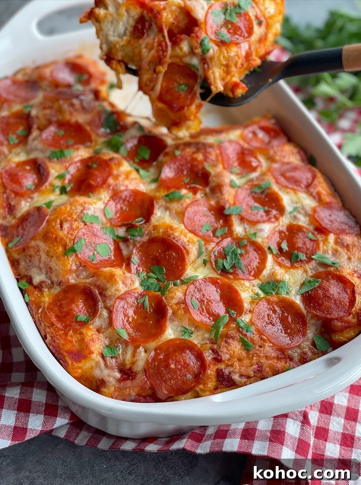 Bubble-Up Biscuit Pizza Casserole Recipe for Family Nights 9 Easy Bubble UP Biscuit Pizza Casserole just out of the oven and ready to be served for dinner! My picky kids love this simple weeknight meal.