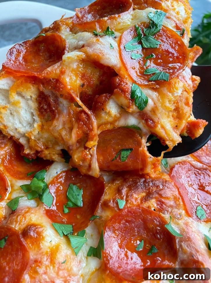 Bubble-Up Biscuit Pizza Casserole Recipe for Family Nights 10 Close up of a pepperoni pizza biscuit casserole! An easy last minute dinner for a family with picky eaters. Kids love pizza, and busy moms love making this fast and effortless meal.