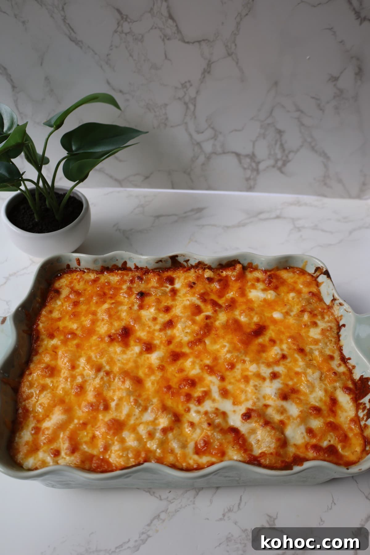 Ultimate Extra-Cheesy Mac and Cheese Recipe for Comfort Meals 5 Extra cheesy mac and cheese inside of a large baking dish.