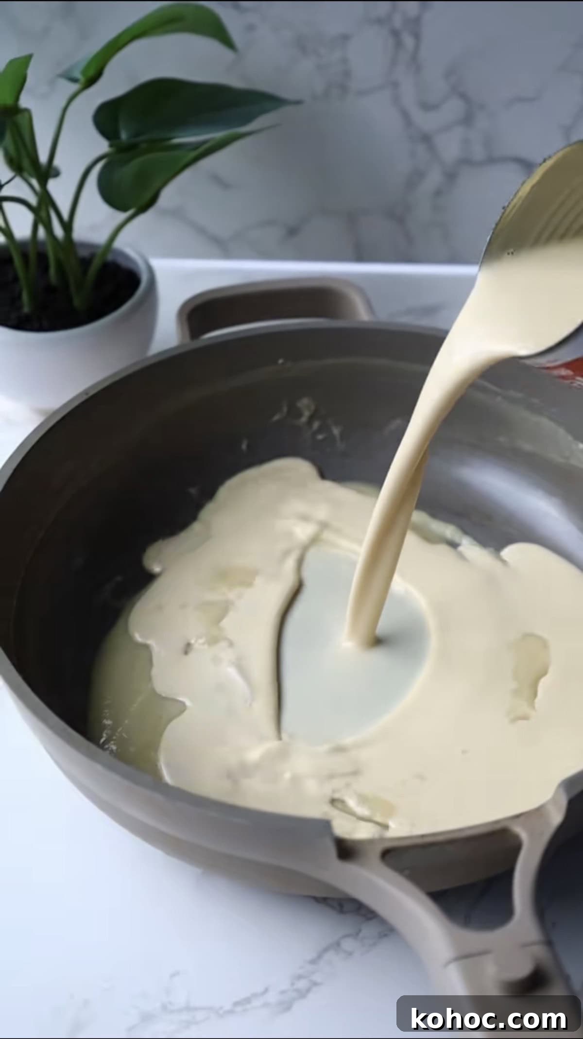 Ultimate Extra-Cheesy Mac and Cheese Recipe for Comfort Meals 7 Step two: add the milk.