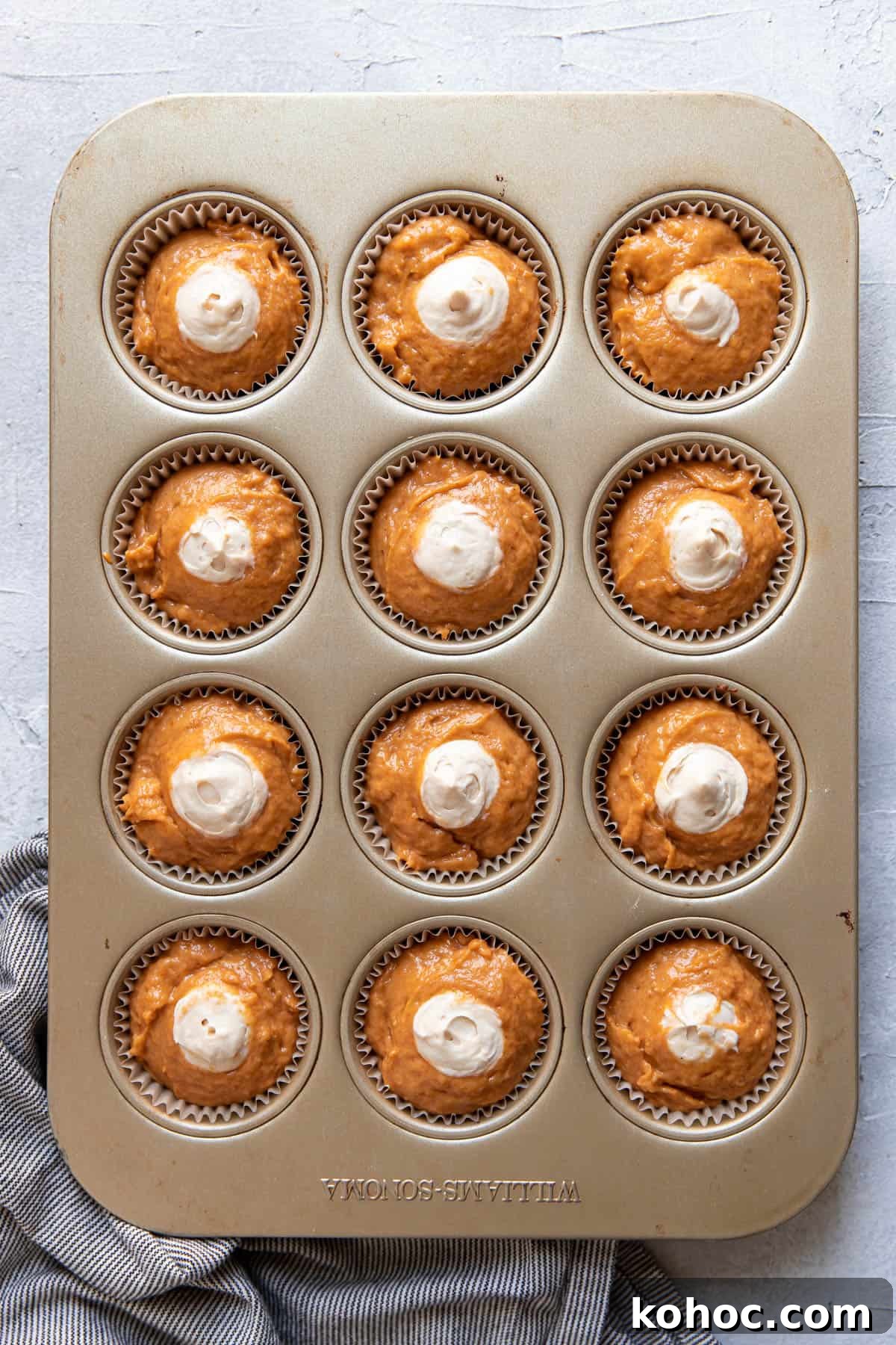 Moist Pumpkin Muffins with Cream Cheese Swirl 7 pumpkin cream cheese muffins before baking.