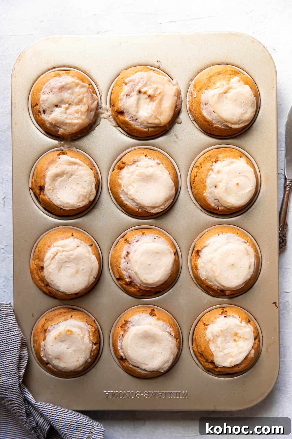 Moist Pumpkin Muffins with Cream Cheese Swirl 8 pumpkin cream cheese muffins after baking.