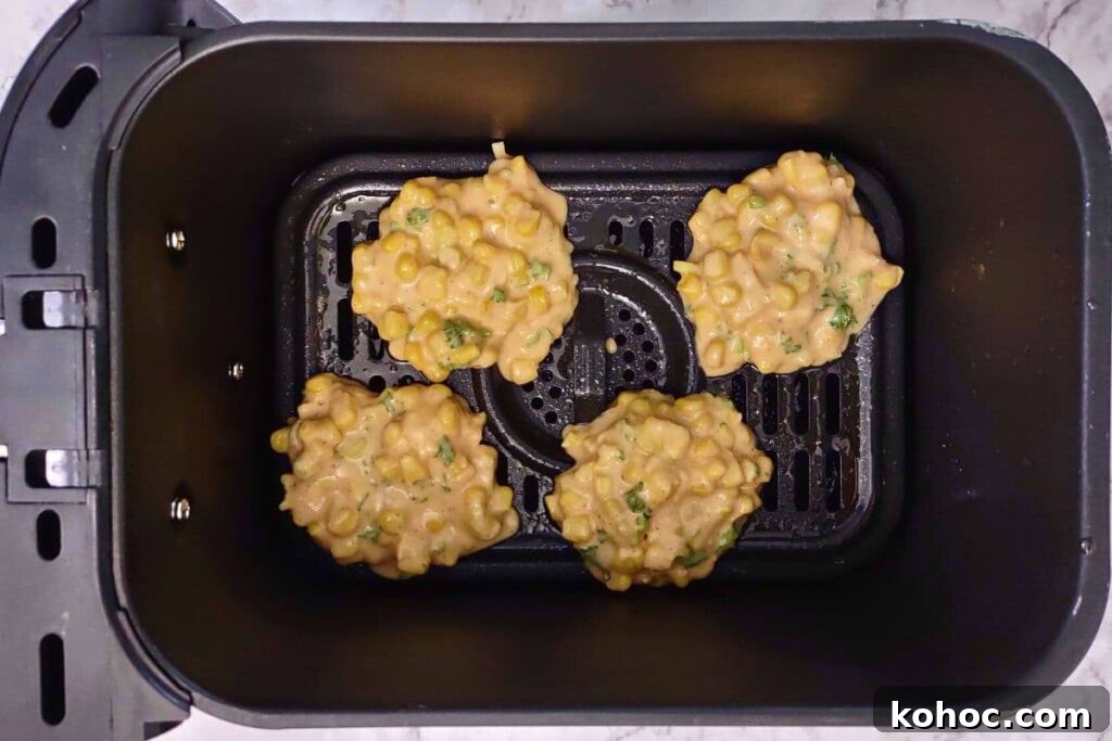 dollop corn fritters into air fryer basket