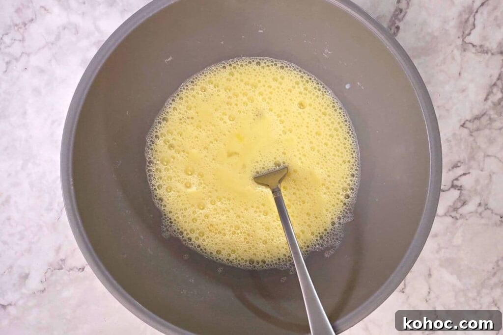 whisk eggs and milk in a bowl