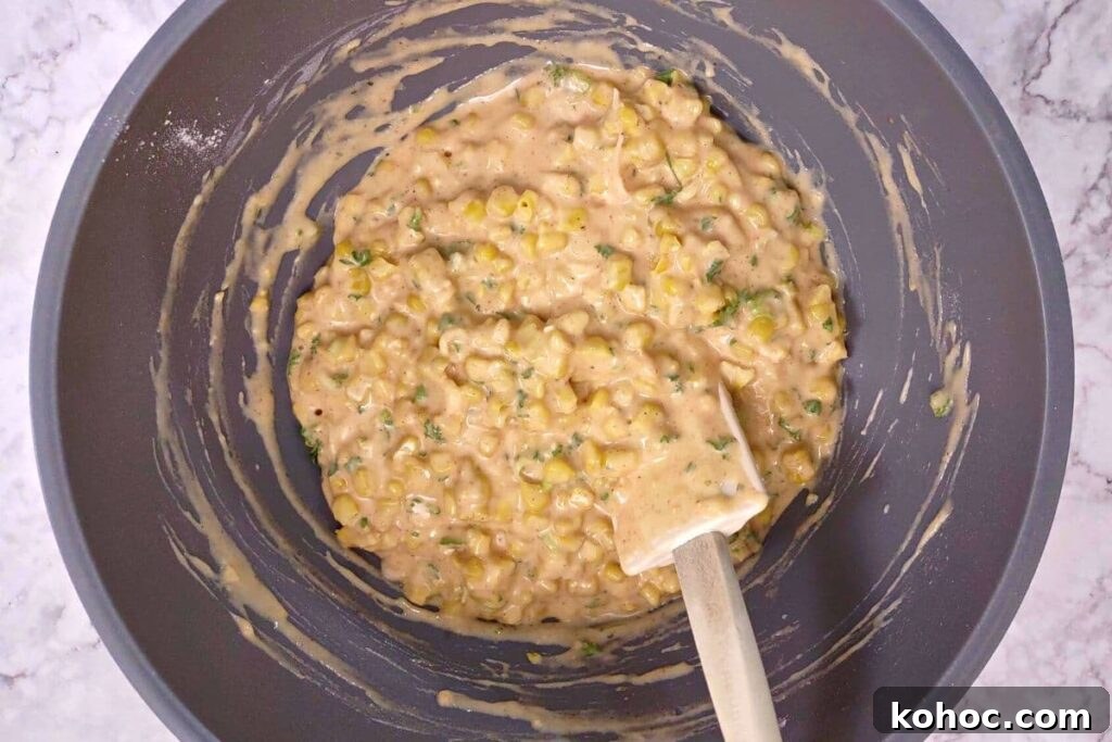 fold corn and herbs into the batter