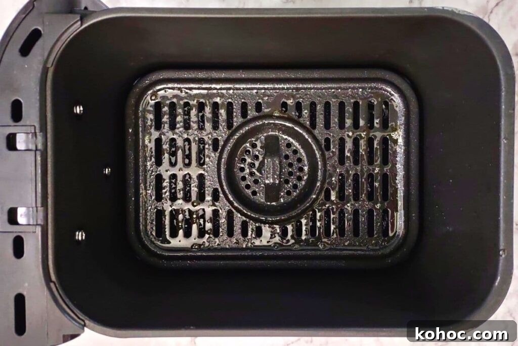 spray air fryer basket with oil or add parchment
