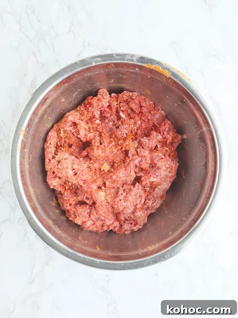 Smoked Meatloaf Recipe for Pellet Grills: Juicy, Flavorful Slice 8 Meatloaf ingredients mixed together in a metal bowl.