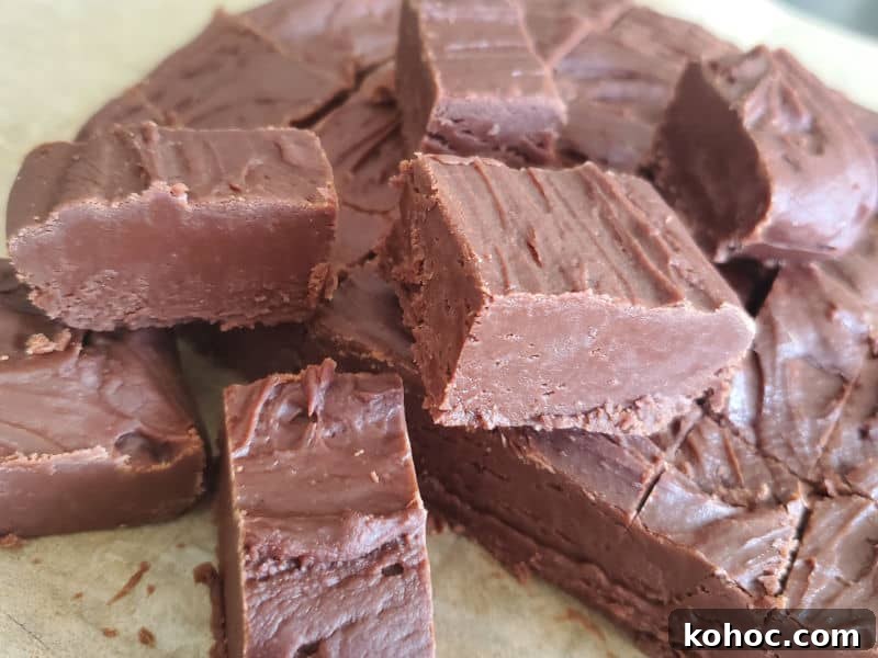 Classic Carnation Condensed Milk Fudge Recipe (Video) 5 Pieces of Carnation Famous Fudge on parchment paper