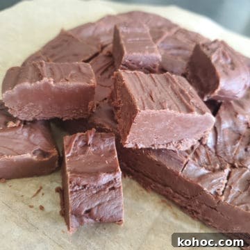 Classic Carnation Condensed Milk Fudge Recipe (Video) 6 Famous Carnation Fudge stacked on parchment paper