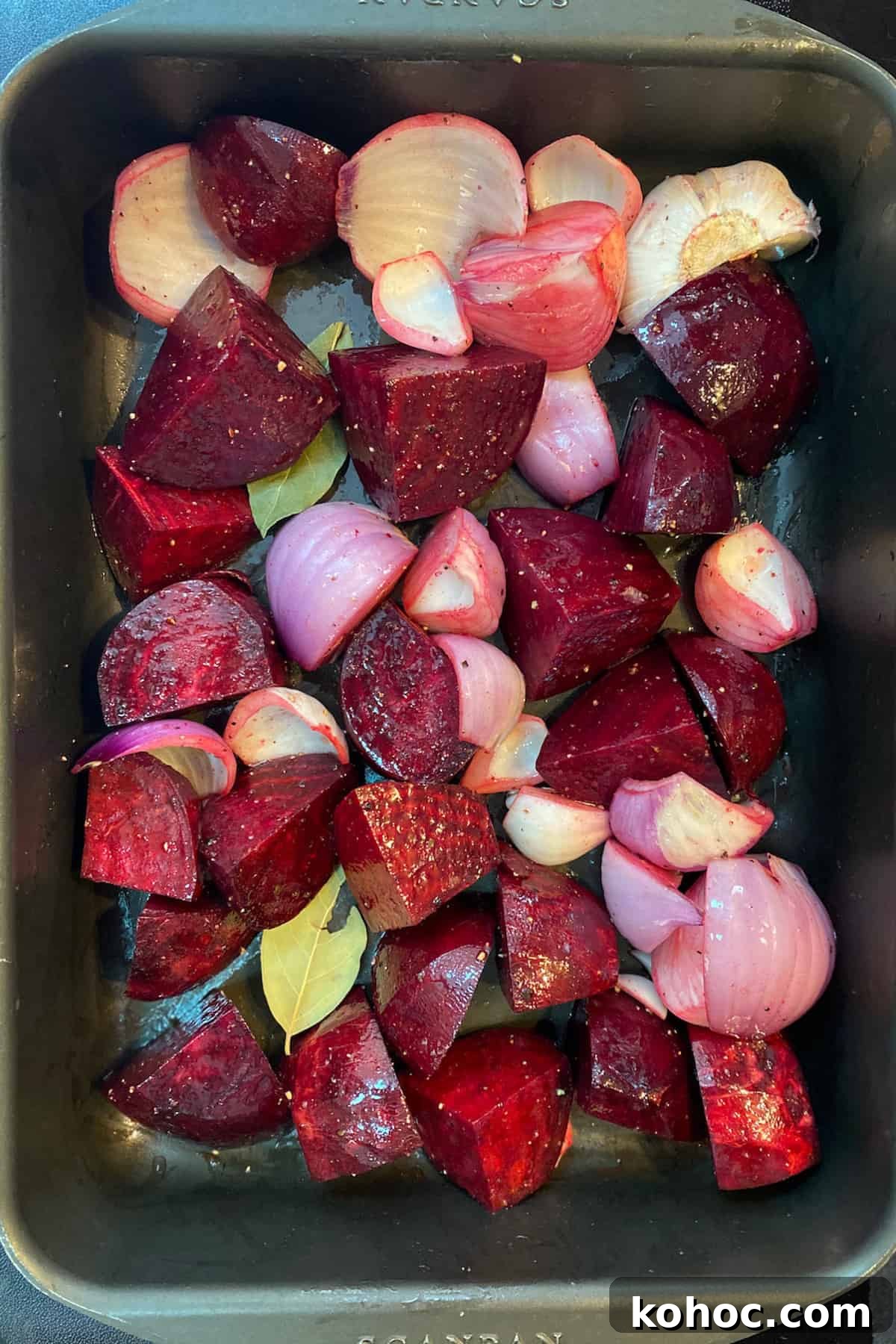Roasted Beet and Walnut Soup Recipe — Comforting Autumn Starter 4 Photo of chopped beetroots, red onions and garlic in a roasting tin ready to go in the oven.