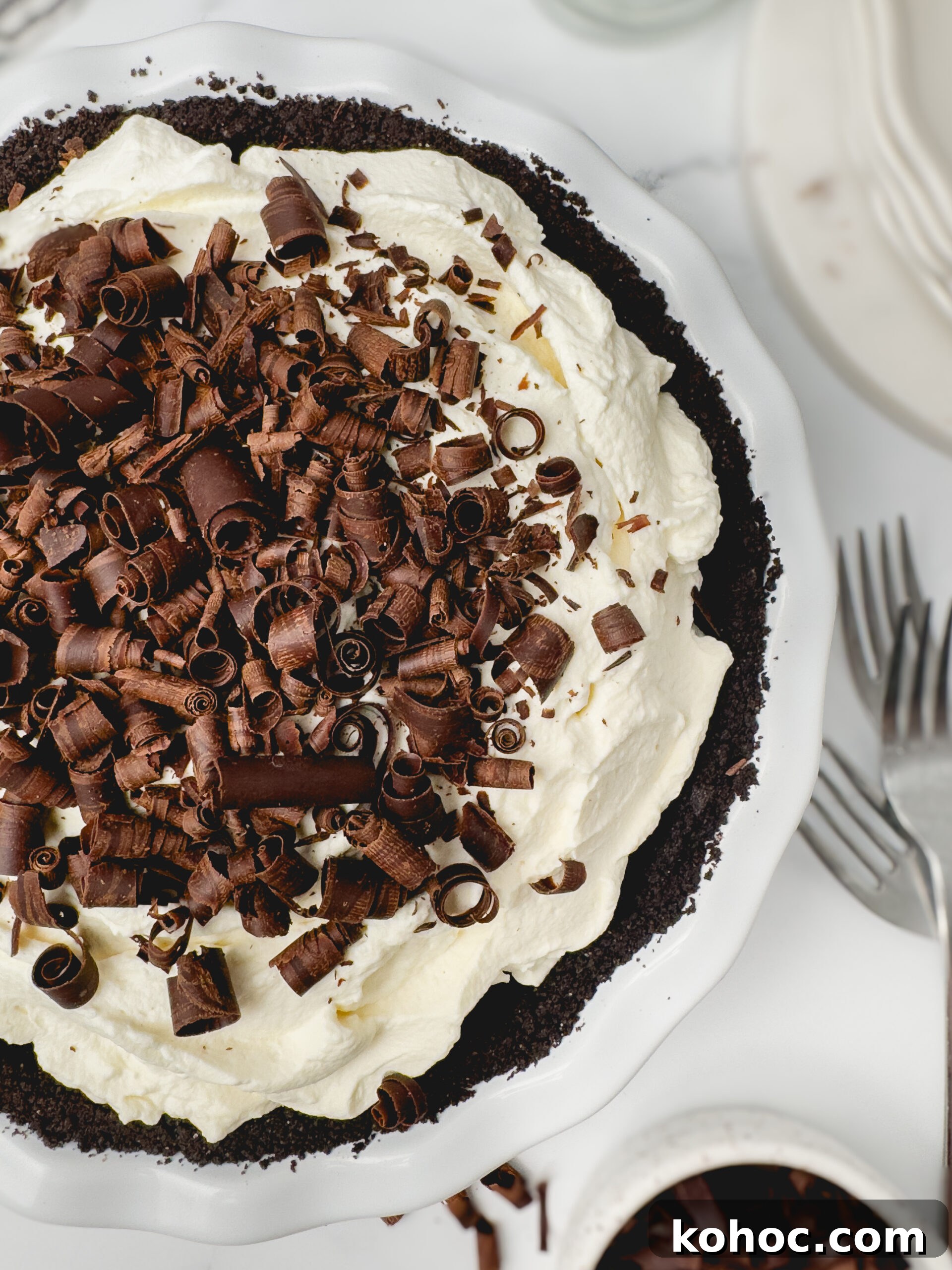 Decadent Chocolate Cream Pie Recipe with Silky Ganache Filling 5 Chocolate curls and pie