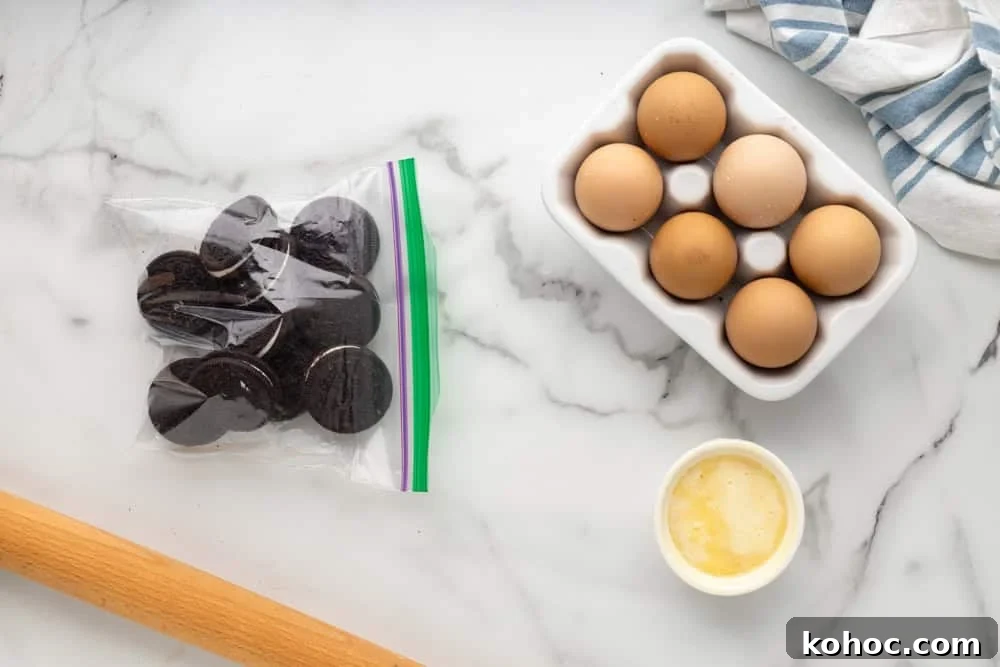 Oreo Brownie Mix Cookie Recipe — Fudgy Oreo Cookies 11 Oreos in a resealable bag, next to eggs and a rolling pin.