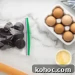 Oreo Brownie Mix Cookie Recipe — Fudgy Oreo Cookies 6 Oreos in a ziplock bag next to a rolling pin.