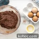 Oreo Brownie Mix Cookie Recipe — Fudgy Oreo Cookies 7 Brownie mix, oreos, eggs and butter mixed together in a large bowl.