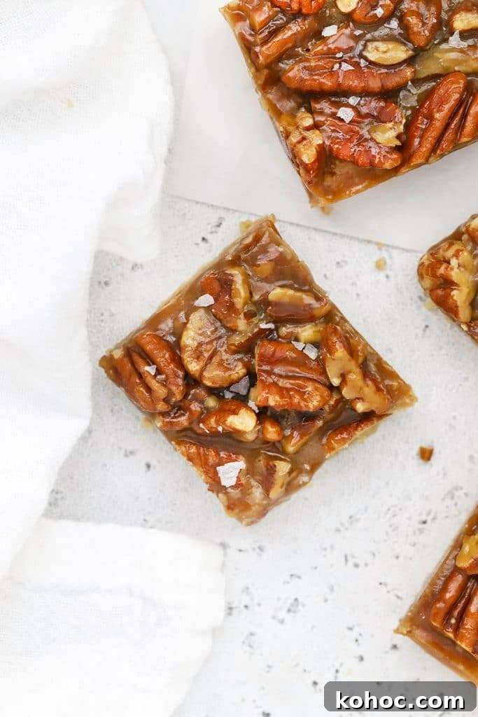 Homemade Caramel Sauce Recipe for Drizzling and Desserts 11 Overhead view of gluten-free salted caramel pecan bars cut into squares