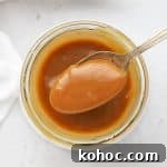 Scooping a spoonful of easy caramel sauce