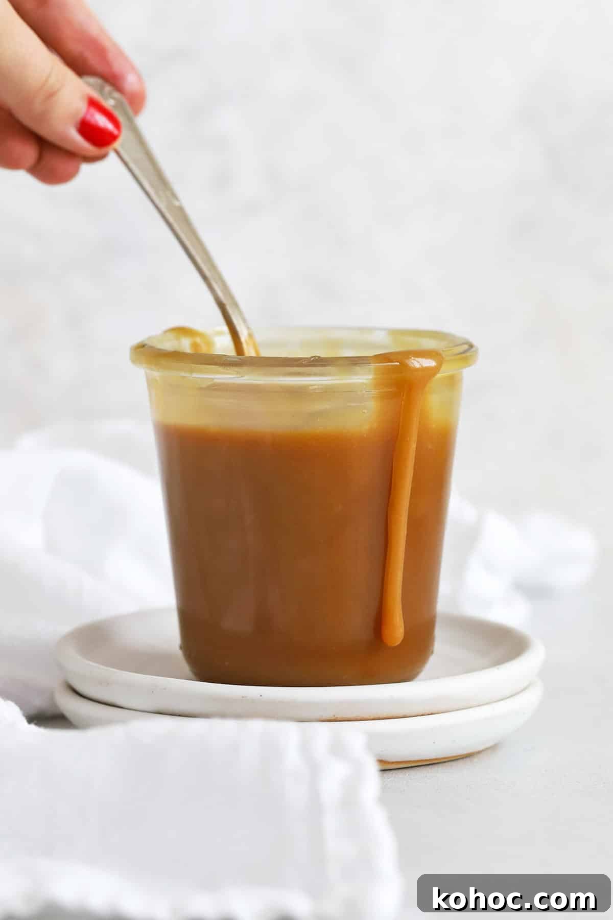 Homemade Caramel Sauce Recipe for Drizzling and Desserts 9 front view of a jar of easy caramel sauce