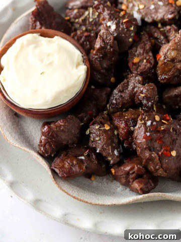 steak bites on a plate with garlic aioli