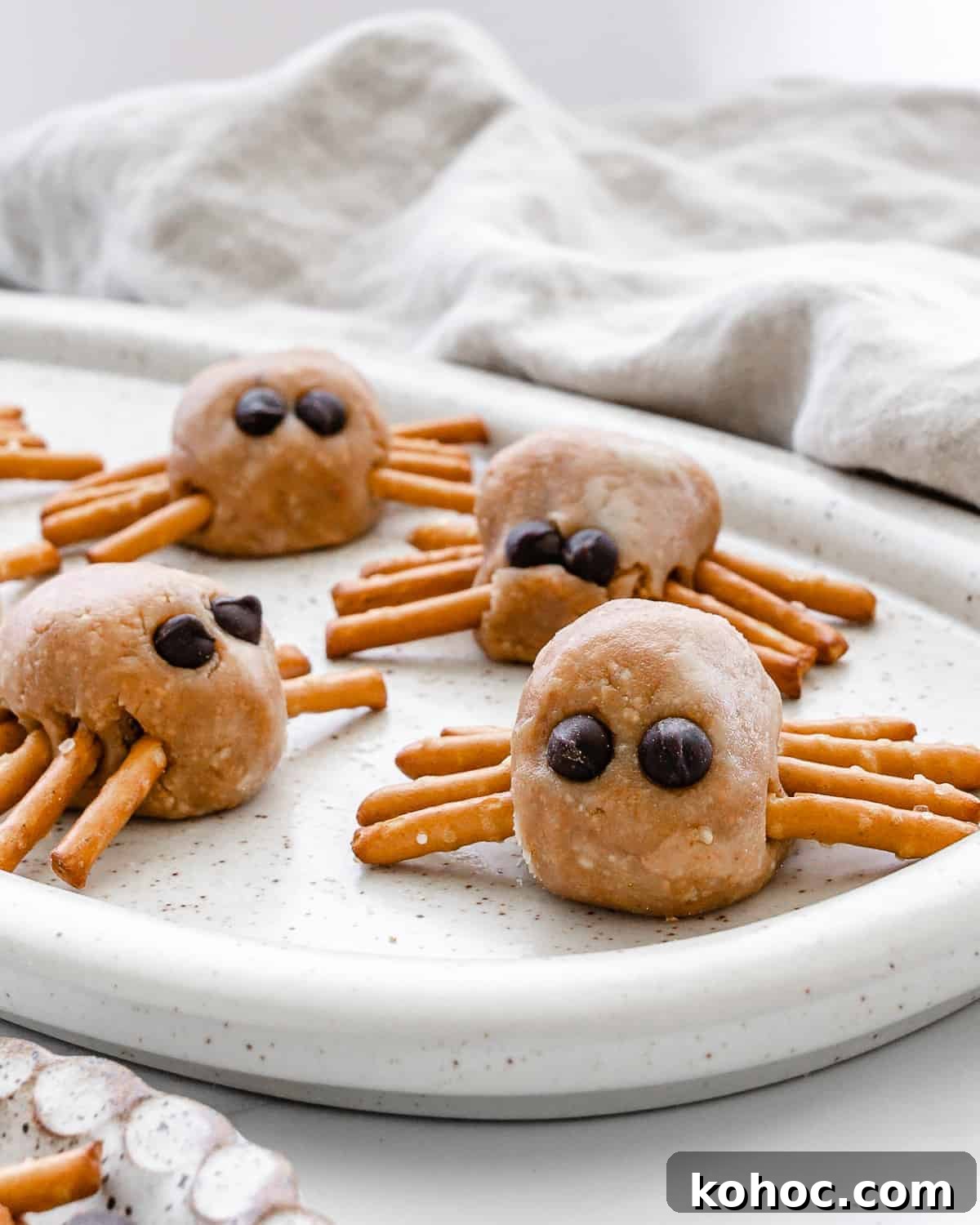 completed halloween spiders on a white speckled tray