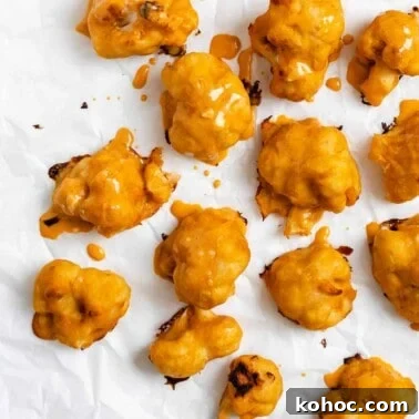 completed Vegan Buffalo Cauliflower Wings [Baked + Air Fried] scattered on a white surface