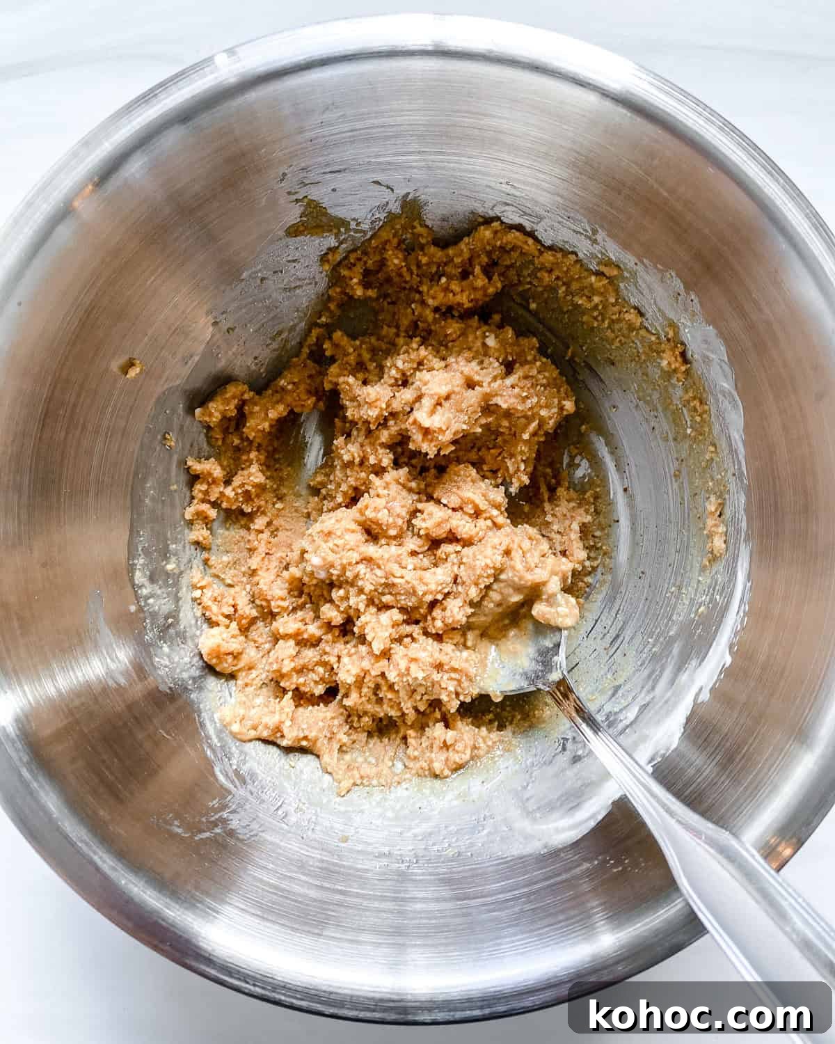 process shot showing mixing ingredients together in bowl