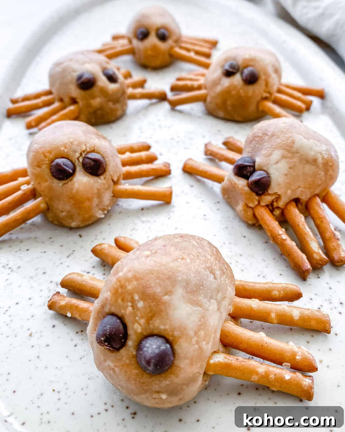 completed Halloween Peanut Butter Spiders on a white platter