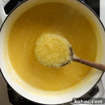 Creamy Italian Polenta Recipe 6 Thickening polenta in a pot.