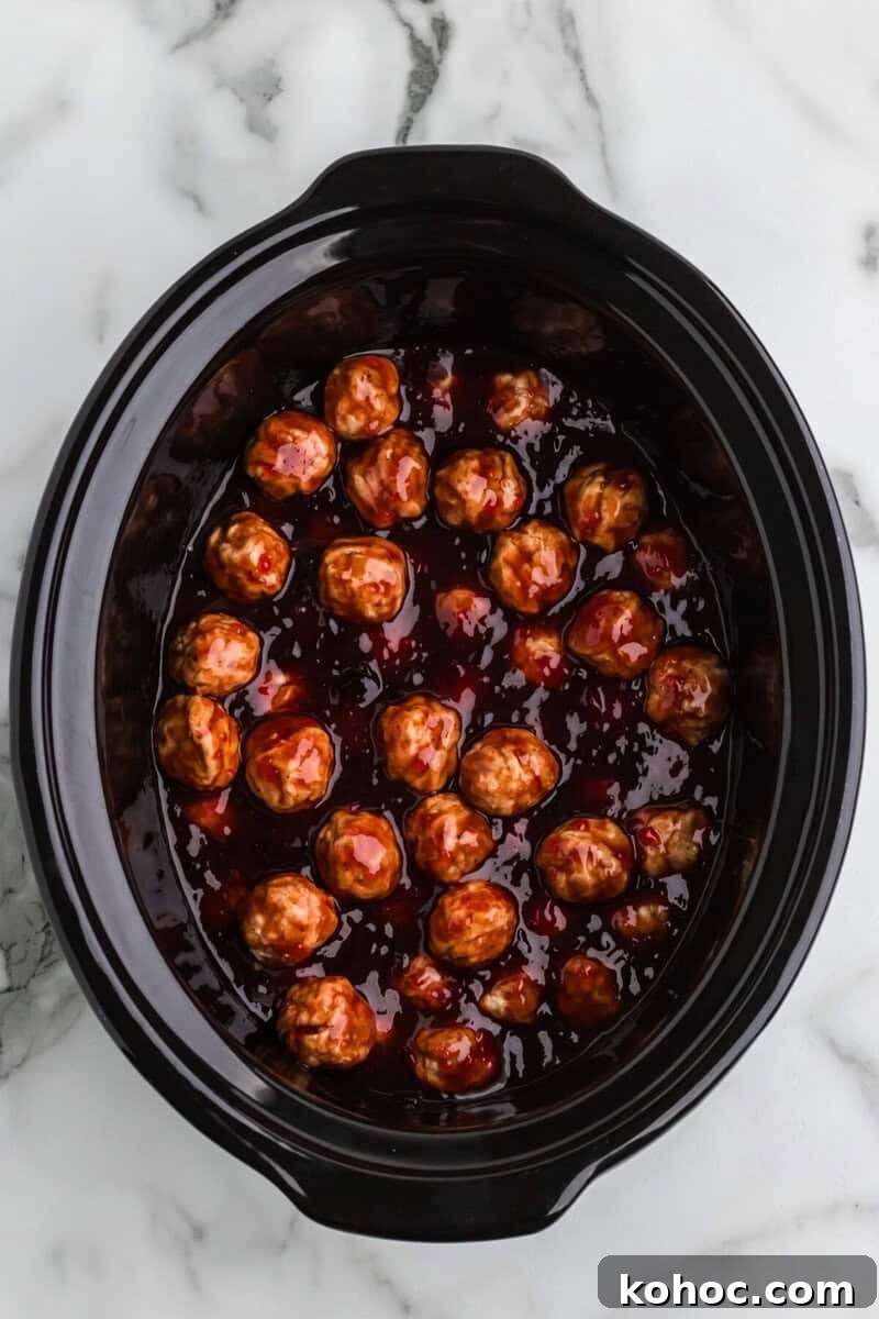 Quick 3-Ingredient Meatball Recipe for Busy Weeknights 6 meatballs added to the slow cooker.