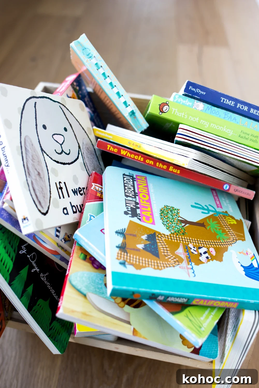 Declutter Kids’ Books: A Simple System to Tidy and Keep Favorites 3 Pile of children's books in a wooden bin