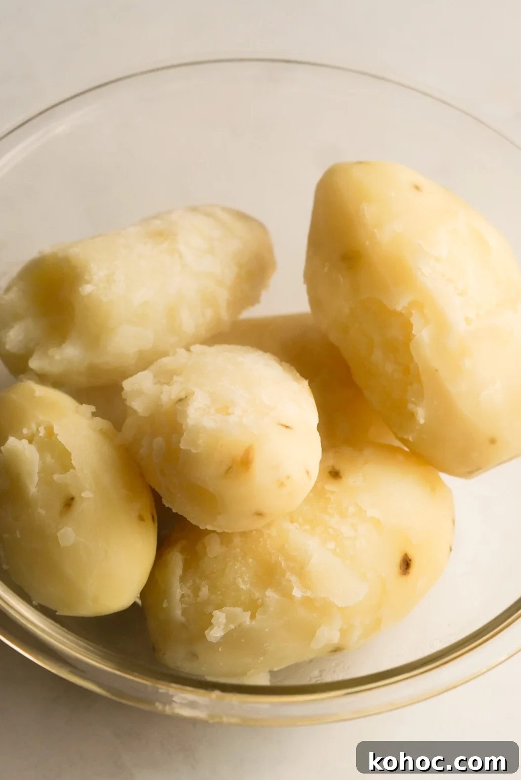 Truffle Mashed Potatoes Recipe: Creamy Garlic Parmesan Mash 6 cooked potatoes in a bowl