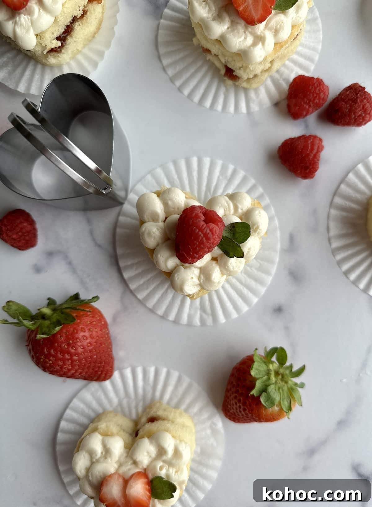 Mini Heart Cakes: Two Simple Ways to Make Adorable Treats 2 Mini Heart Cakes cut out from a sheet pan.