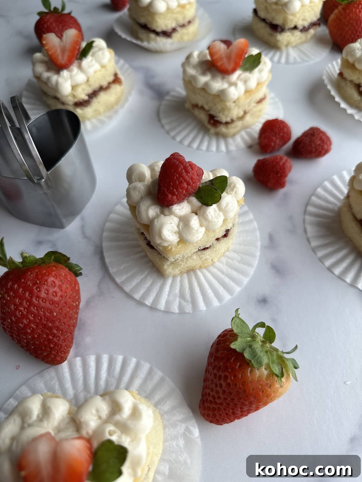 Mini Heart Cakes: Two Simple Ways to Make Adorable Treats 3 Mini heart cakes with raspberry and strawberry cake filling.