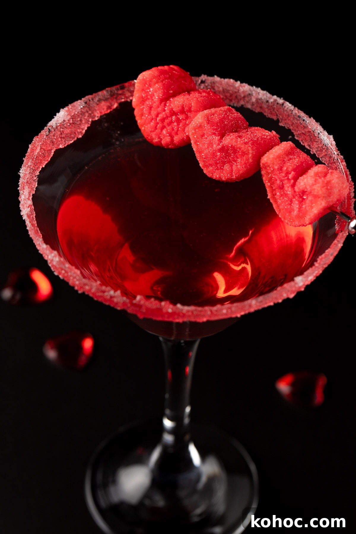 Romantic Love Potion Cocktail Recipe for Date Night 6 A red Valentine’s love cocktail in a martini glass, on a black background.