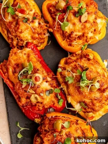 Stuffed peppers topped with microgreens.