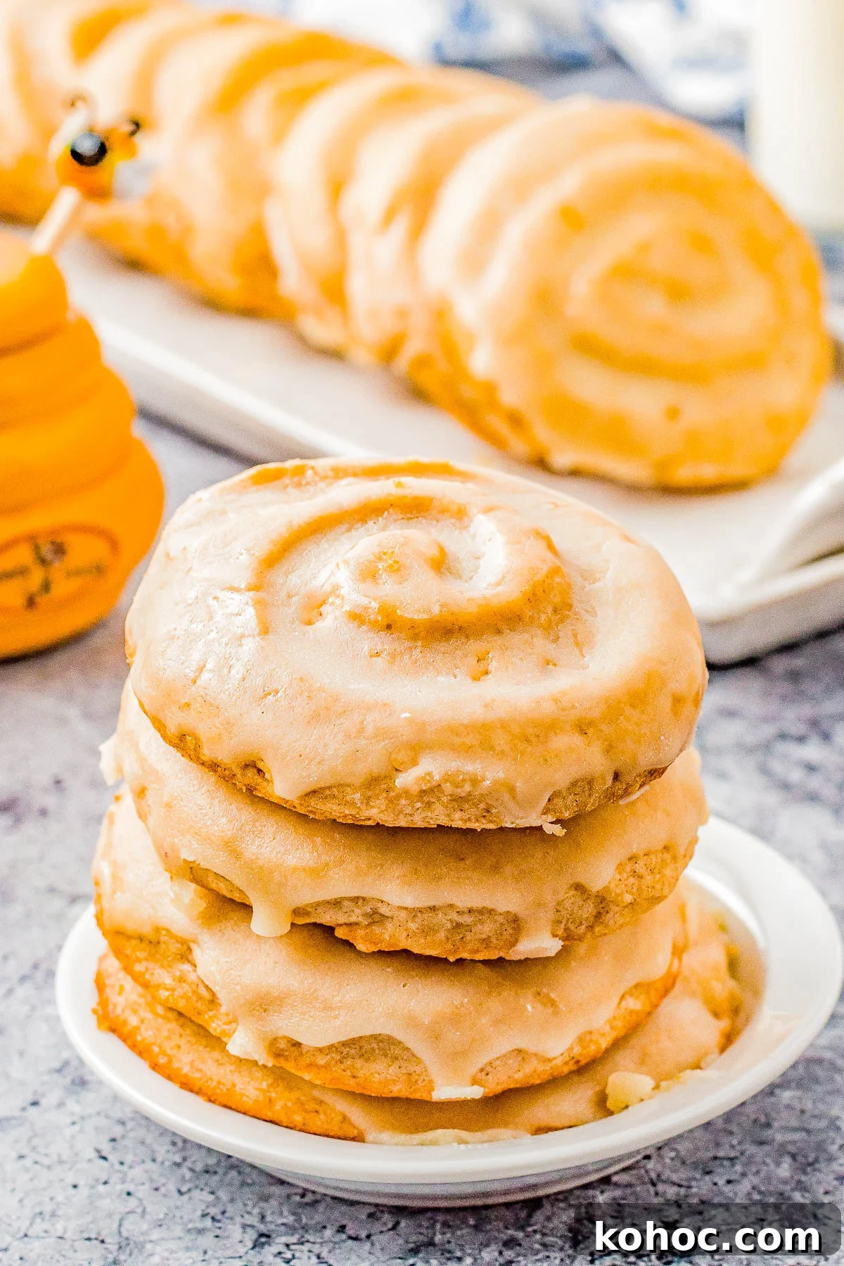 Honey Bun Cookies (Crumbl Cookies Copycat) - Soft and chewy with a warm buttery cinnamon flavor, these cookies resemble a classic Honey Bun with their fun swirl on top! The sweet honey glaze makes them IRRESISTIBLE! This EASY Crumbl Cookies copycat recipe will become a family FAVORITE! 