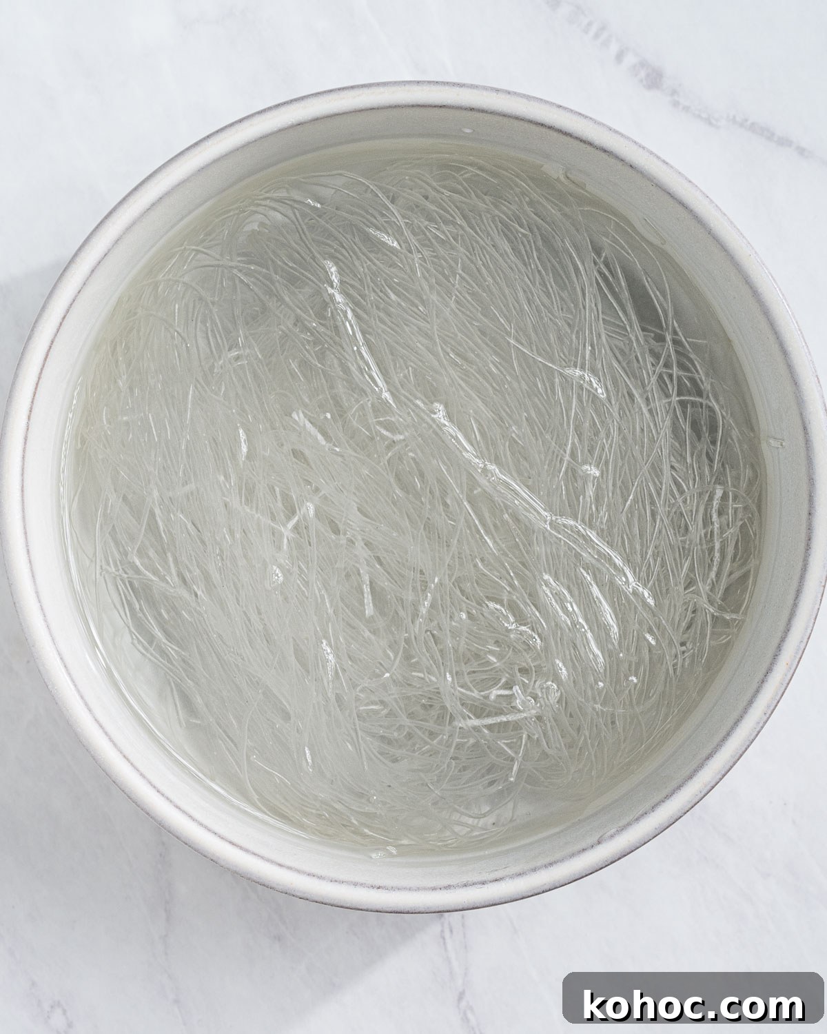 Perfect Rice Noodles: How to Cook Them Without Overcooking 8 Vermicelli soaking in a bowl of water.