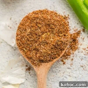 Fajita seasoning on a wooden spoon.