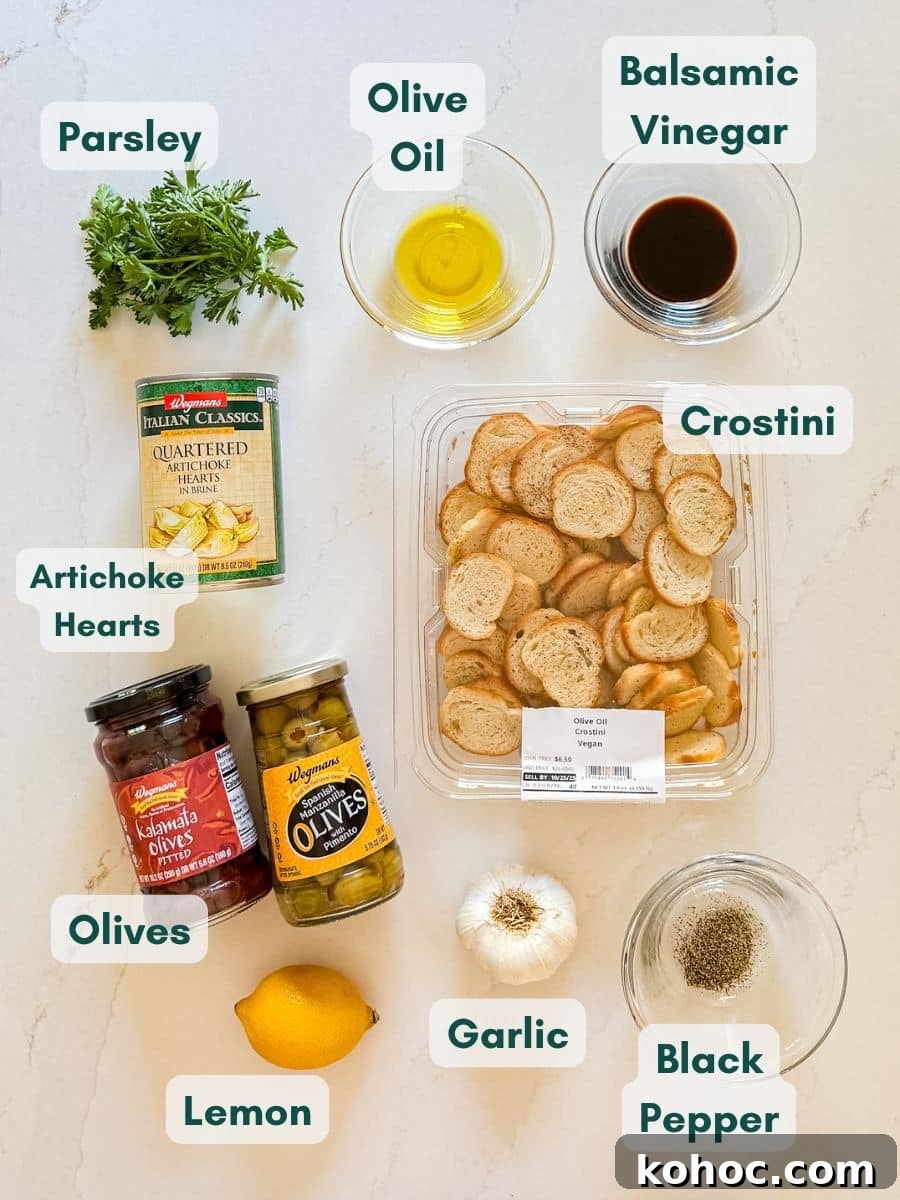 Creamy Artichoke and Olive Dip Recipe 4 An overhead image of labeled recipe ingredients.