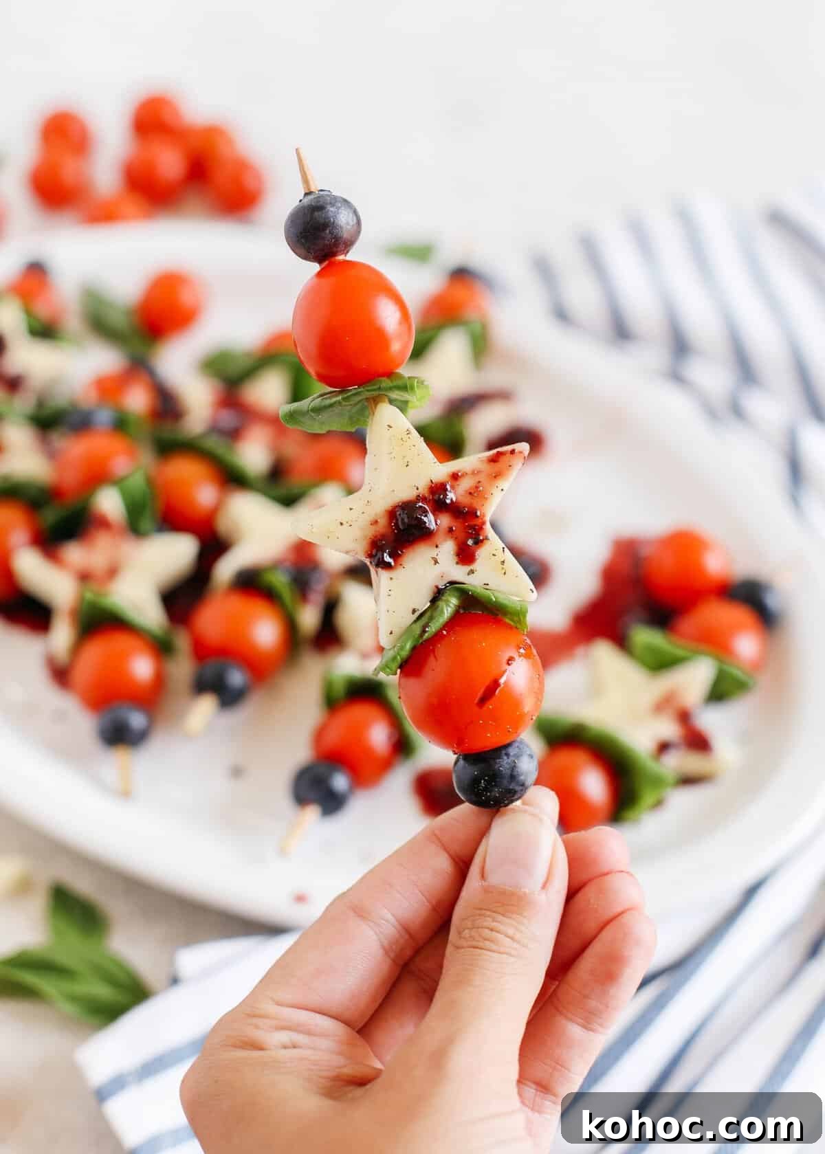 Blueberry Balsamic Glazed Caprese Skewers Recipe 4 Caprese skewers on a platter
