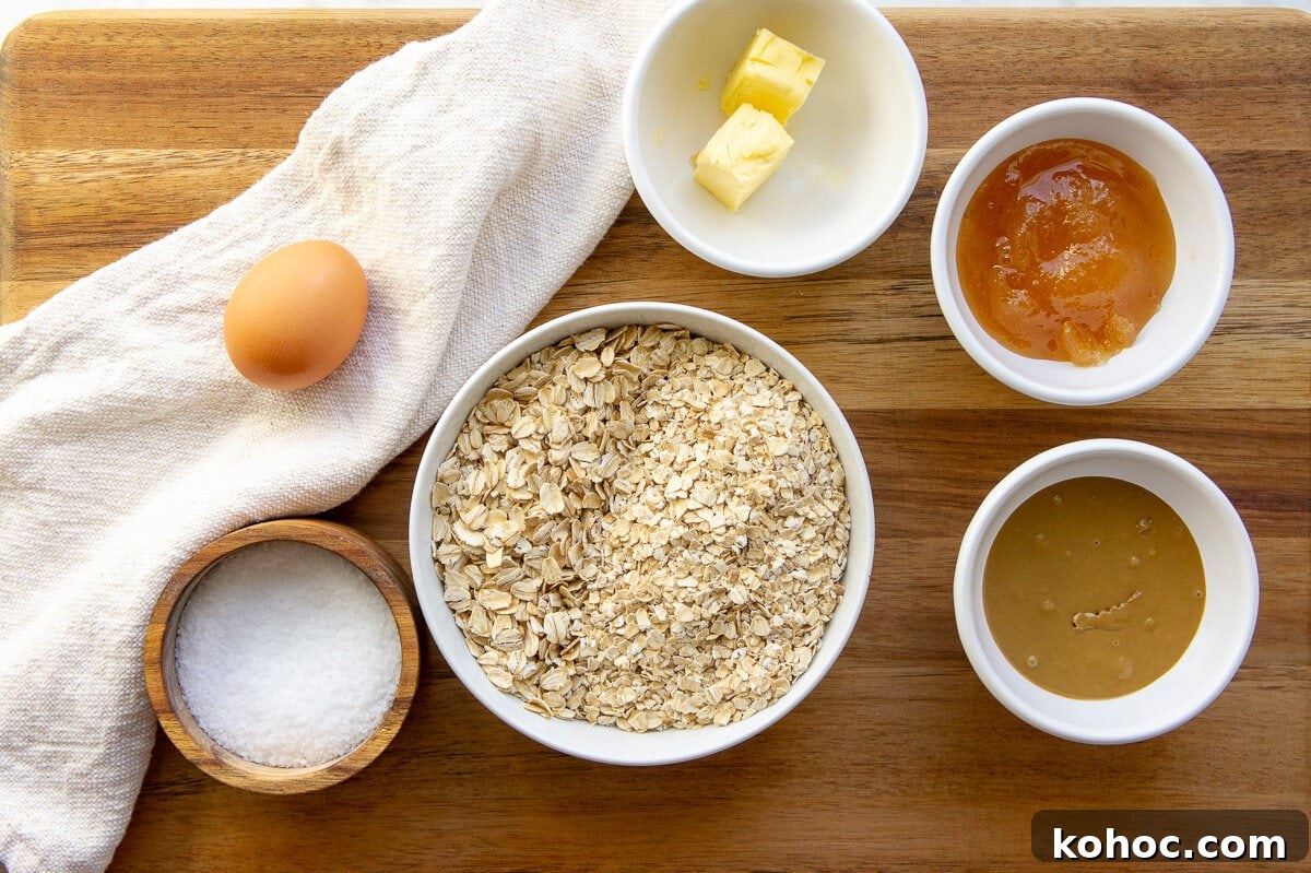Baked Nut-Free Granola Bars Recipe 3 ingredients for nut-free granola bars including oats, honey, sunflower seed butter, and egg.